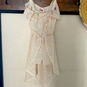 white dress with built in shorts. machine wash cold. 100% polyester.